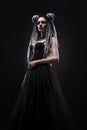 Woman with dreads and black gothic dress