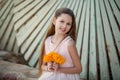 Beautiful girl at sunset in flowers. Royalty Free Stock Photo