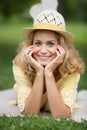 woman dress lying on grass holding head in hands Royalty Free Stock Photo