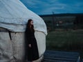 A woman in a dress near the traditional Mongolian dwelling yurt Royalty Free Stock Photo