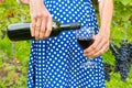 Woman in dress pouring red wine bottle in glass Royalty Free Stock Photo