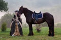 Woman in dress royal baroque riding