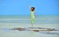 Woman in dress on a sandbank in the ocean. Royalty Free Stock Photo