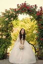 Woman with dress and veil at rose bouquet. Royalty Free Stock Photo