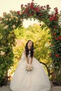 Woman with dress and veil at rose bouquet. Royalty Free Stock Photo