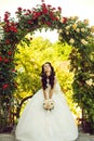 Woman with dress and veil at rose bouquet. Royalty Free Stock Photo