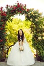 Woman with dress and veil at rose bouquet. Royalty Free Stock Photo
