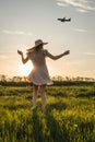 Woman in dress is spinning in the field Royalty Free Stock Photo