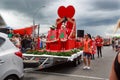 Woman dressed as the Queen of Hearts at a Christmas parade