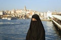Woman dressed with black headscarf, chador on istanbul street, turkey Royalty Free Stock Photo