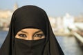 Woman dressed with black headscarf, chador on istanbul street, turkey