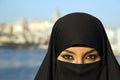 Woman dressed with black headscarf, chador on istanbul street, turkey Royalty Free Stock Photo