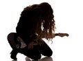 Woman squatting and clutching guitar Royalty Free Stock Photo
