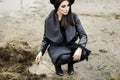 Woman dressed in coat and black hat Royalty Free Stock Photo