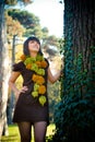 Woman dressed in handmade knitted dress and scarf.