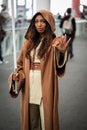 Woman is dressed in a Jedi costume from the Star Wars franchise