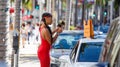 Woman dressed in red in Beverly Hills.