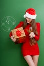 Woman dressed in red dress and santa hat Royalty Free Stock Photo