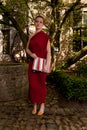 Woman red antique dress, Groot Begijnhof, Leuven, Belgium Royalty Free Stock Photo