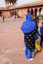 Woman dressed in traditional clothing at Jama Masjid mosque in Delhi Royalty Free Stock Photo