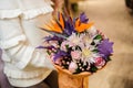 Bright and colorful valentine bouquet in womans hands