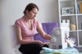 Woman dressmaker working sewing machine. the process of creating clothes at home Royalty Free Stock Photo