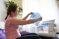 Woman dressmaker working sewing machine. the process of creating toys elephant with their hands at home. sewing as a hobby for the Royalty Free Stock Photo