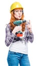 woman with a drill in protective clothes doing home repair Royalty Free Stock Photo