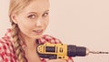 Woman drilling in wall Royalty Free Stock Photo