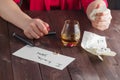 Woman drink alcohol and write message Royalty Free Stock Photo