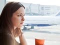 Woman drink coffee in airport