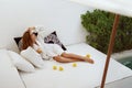 Woman drink lemonade on terrace bed