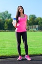 Woman drink water bottle sport on stadium Royalty Free Stock Photo