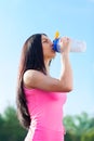 Woman drink water bottle sport on stadium Royalty Free Stock Photo