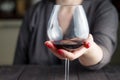 Woman drinking alcohol on dark background Royalty Free Stock Photo