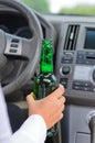 Woman drinking alcohol and driving Royalty Free Stock Photo