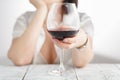 Woman drinking alcohol on white background. Focus on wine glass Royalty Free Stock Photo