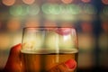 Woman Drinking Beer Concept. Closeup of Glass of Beer with Red Lipstick Mark in Bar or Restaurant