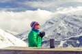 Woman drinking camping in inspirational mountain landscape