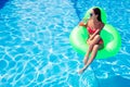 Woman drinking cocktail on air mattress Royalty Free Stock Photo