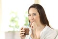 Woman drinking cocoa shake with a straw