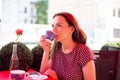 Woman drinking coffee in a cafe