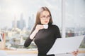 Woman drinking coffee, doing paperwork Royalty Free Stock Photo