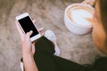 woman drinking coffee hands holding touching mobile phone with blank copy space for your text message in cafe Royalty Free Stock Photo