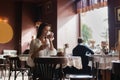 Woman drinking coffee in the morning at restaurant soft focus. Royalty Free Stock Photo