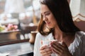 Woman drinking coffee in the morning at restaurant soft focus. Royalty Free Stock Photo