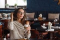 Woman drinking coffee in the morning at restaurant soft focus on the eyes Royalty Free Stock Photo