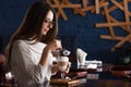 Woman drinking coffee in the morning at restaurant soft focus on the eyes . Royalty Free Stock Photo