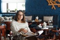 Woman drinking coffee in the morning at restaurant soft focus on the eyes Royalty Free Stock Photo