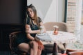 Woman drinking coffee in the morning at restaurant soft focus. pretty girl with cup of cappuccino. lady enjoy. Beautiful Royalty Free Stock Photo
